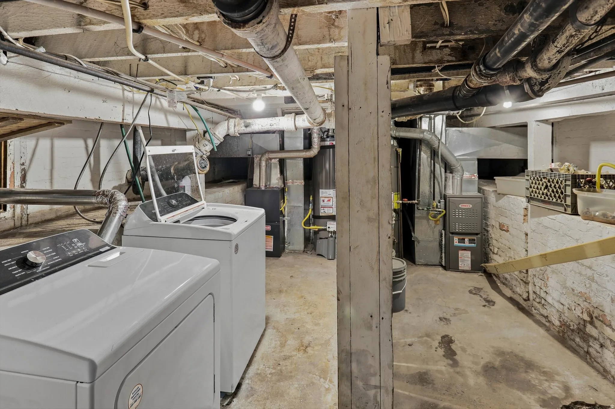 Shared laundry in basement and utility space