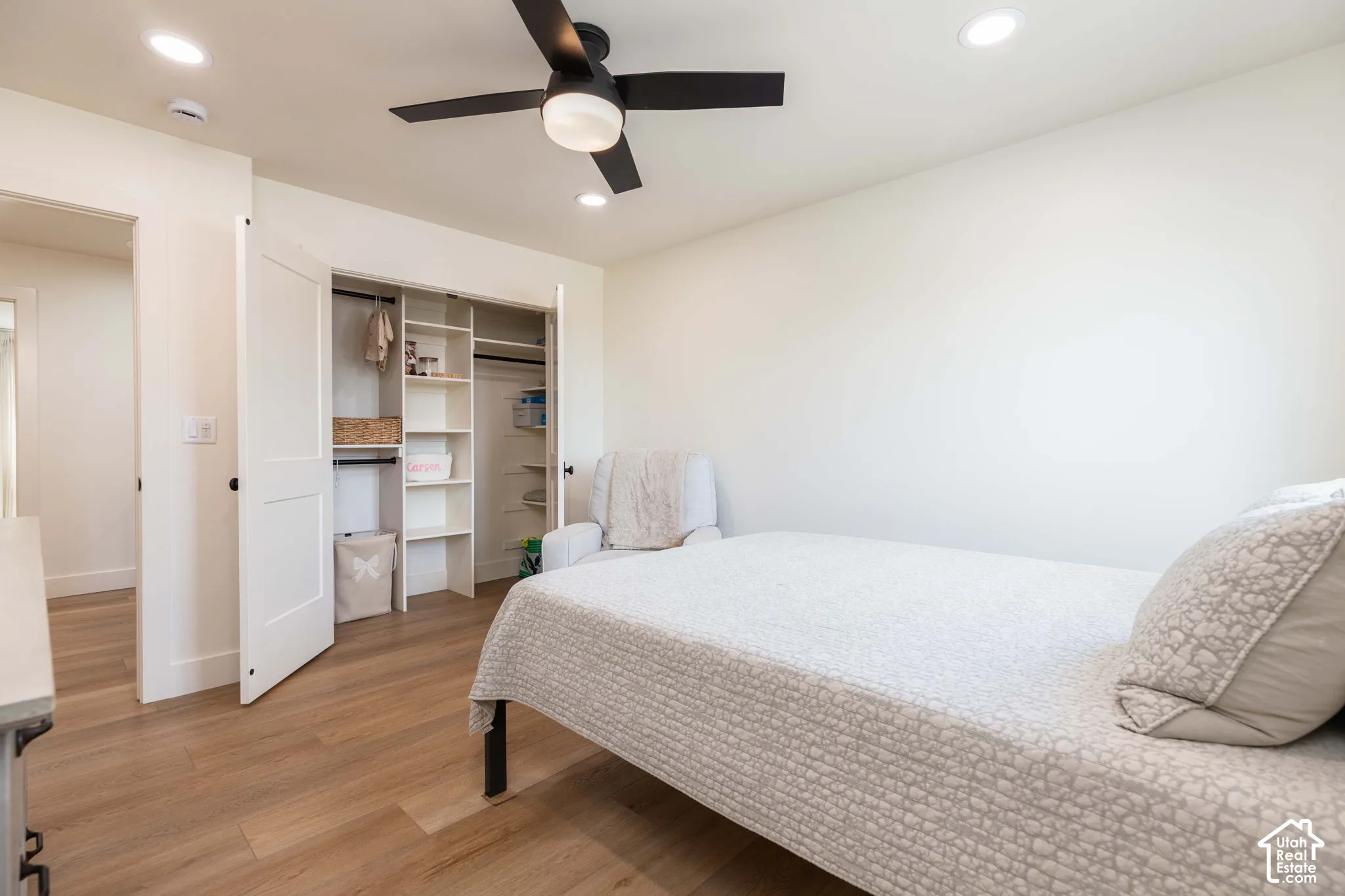 Bedroom featuring wood-finish flooring, recessed lighting, and a contemporary ceiling fan with light fixture