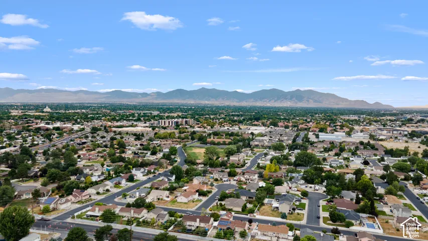 Suburban landscape featuring a network of streets and residential properties