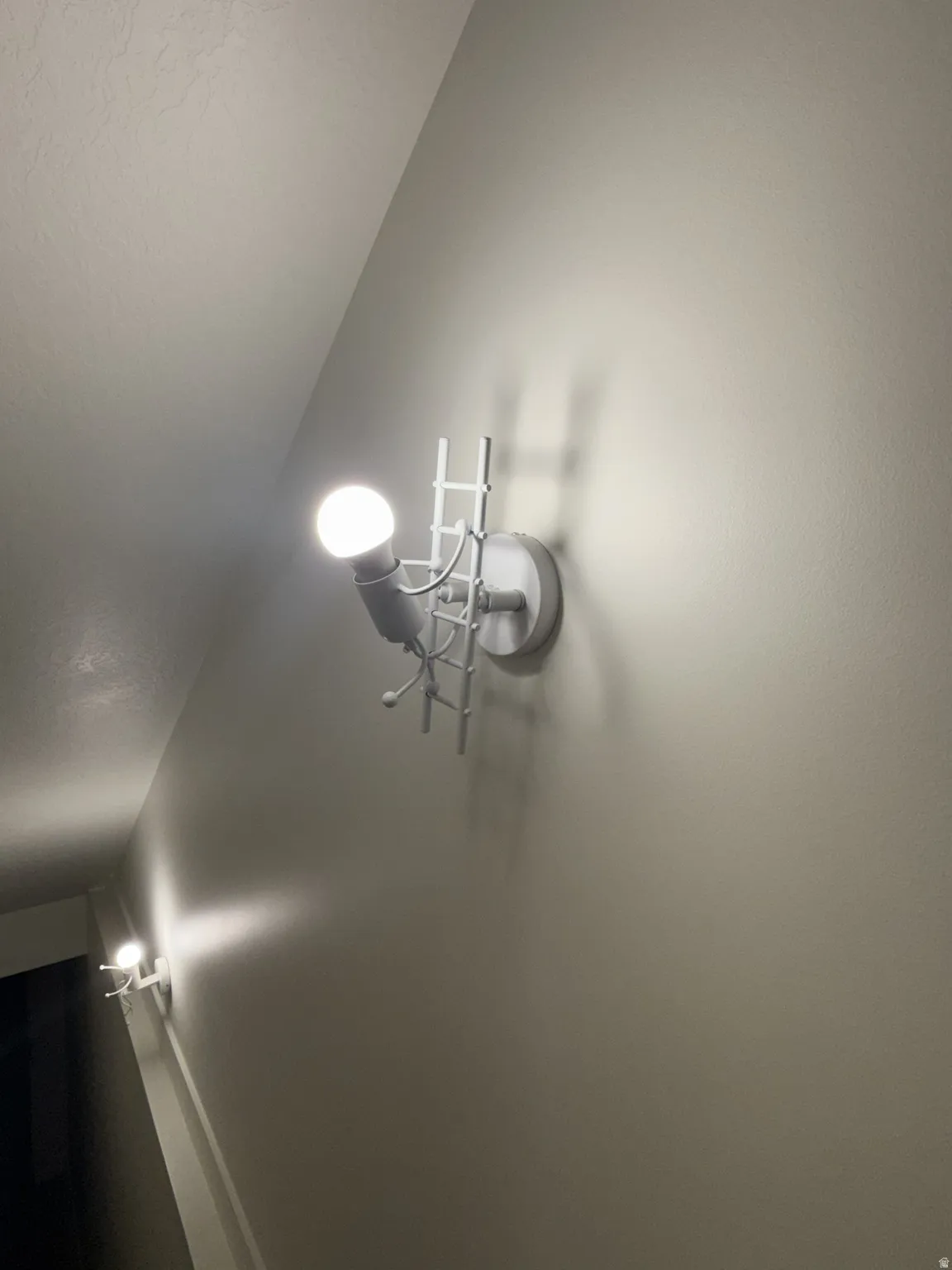 Architectural wall sconces featuring a ladder design