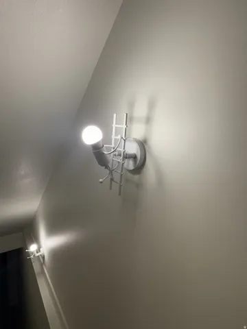 Architectural wall sconces featuring a ladder design