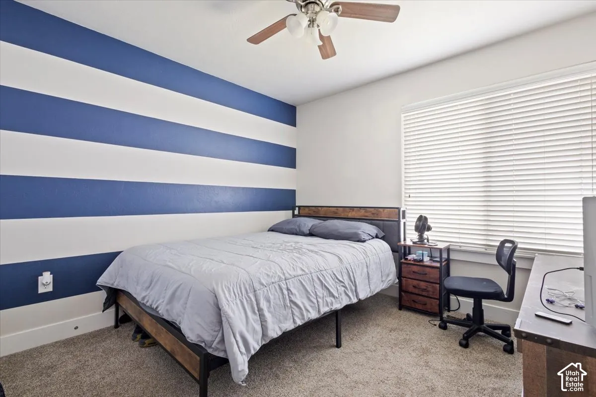 Room featuring a prominent blue and white striped accent wall