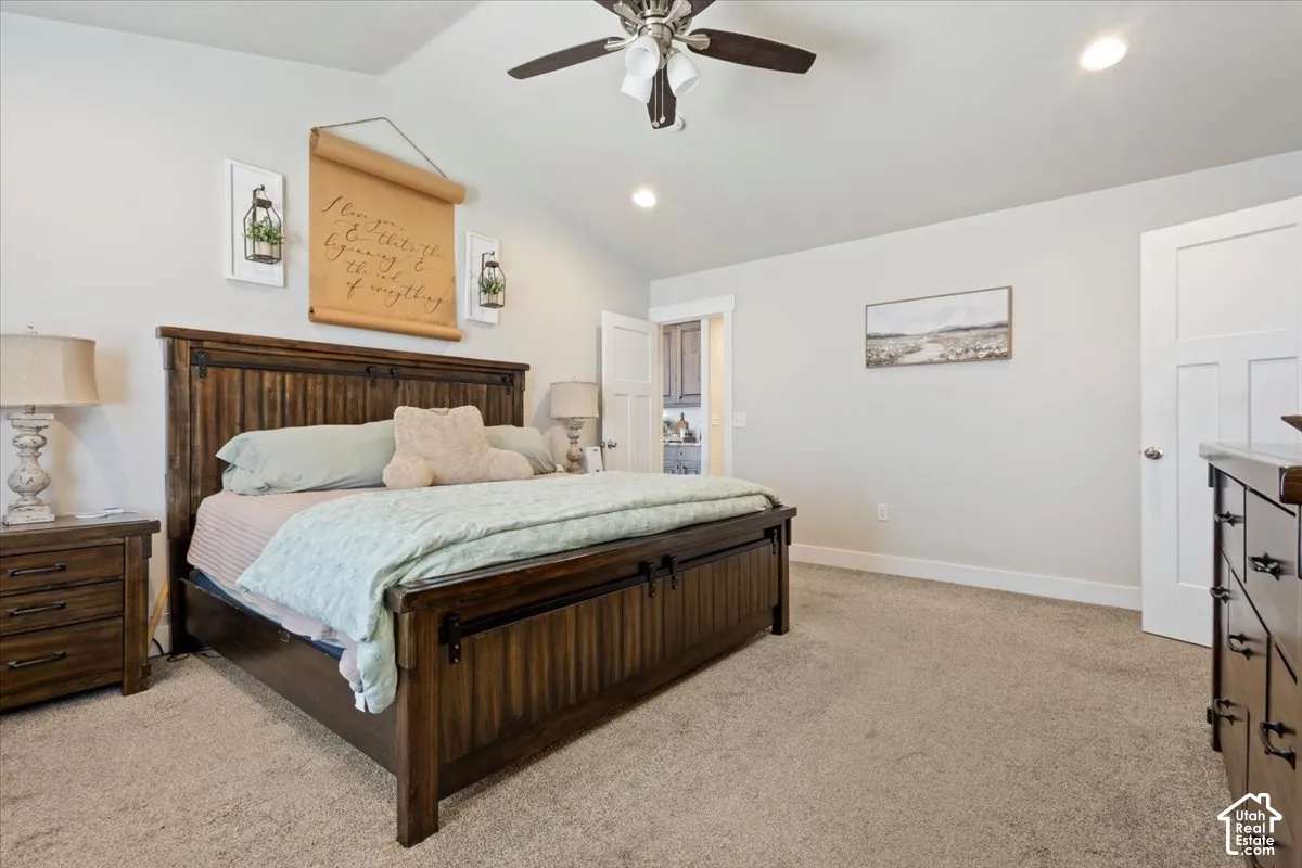 Spacious room with plush carpet flooring, recessed lighting, and a ceiling fan
