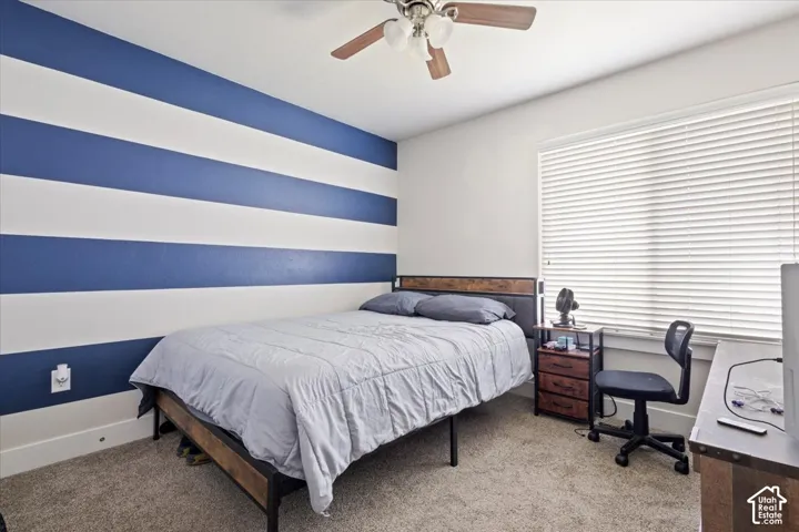 Room featuring a prominent blue and white striped accent wall