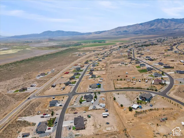 Aerial perspective showcasing a residential development with paved roads and individual properties