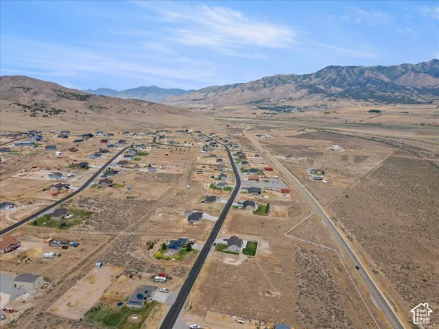 Expansive aerial showcasing a developing residential area with paved streets