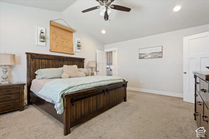 Spacious room with plush carpet flooring, recessed lighting, and a ceiling fan