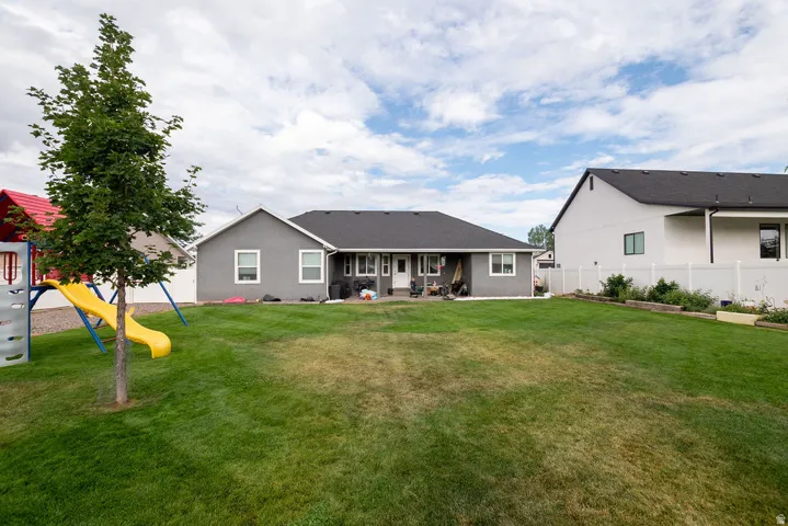Expansive lawn area with a full privacy fence