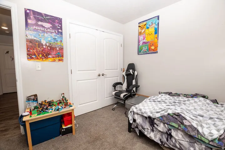 Neutral-toned walls complement the carpeted flooring