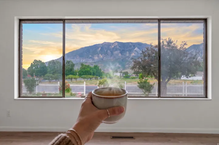 Expansive picture window offering mountain and landscape scenery