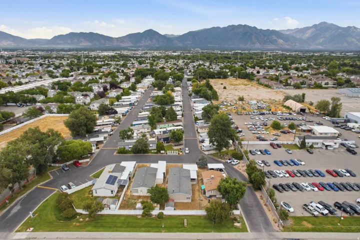 Aerial perspective featuring a residential area with visible mountains in the background