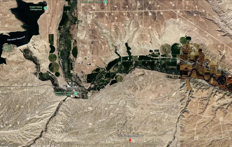 Satellite Imagery. Displaying a geographical area with a reservoir, agricultural patterns, and terrain features