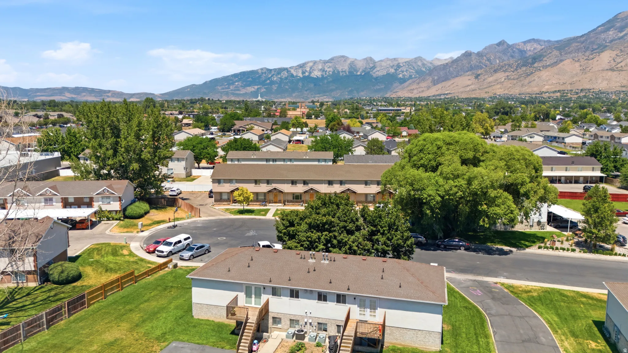 Aerial perspective showcasing a residential community with multi-unit structures