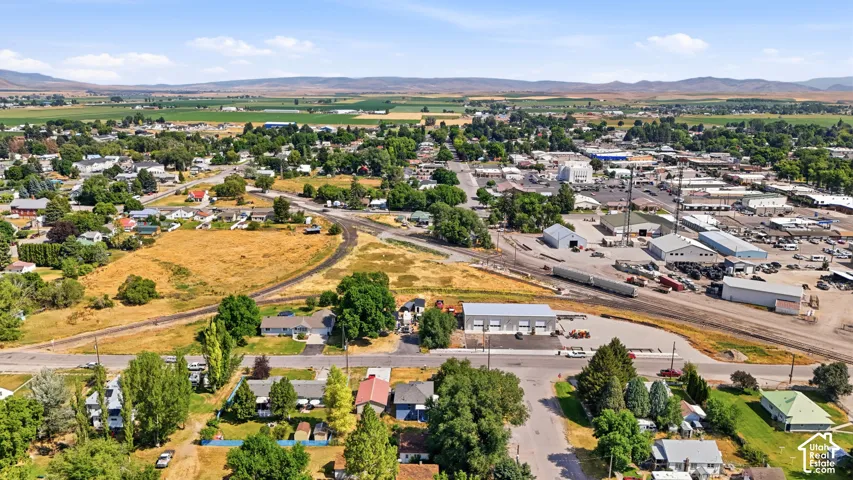 Aerial perspective showcasing the community, surrounded by agricultural fields and distant hills