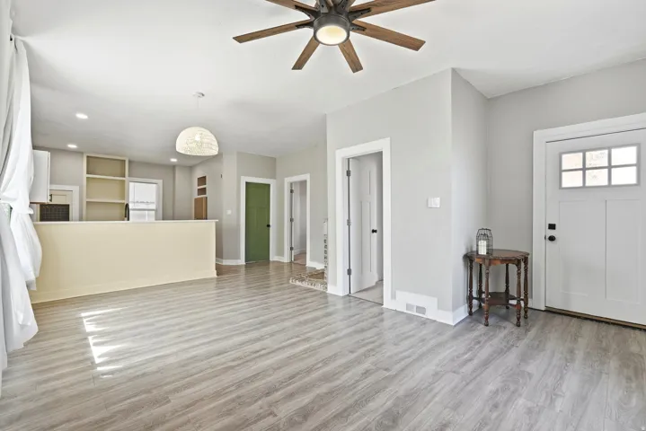 Bright interior featuring wood-finish flooring throughout
