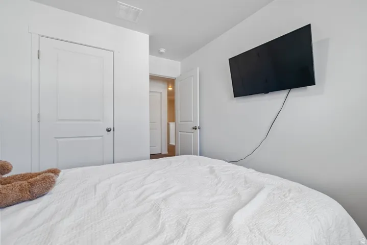 White panel doors with brushed nickel hardware, and neutral white wall finish
