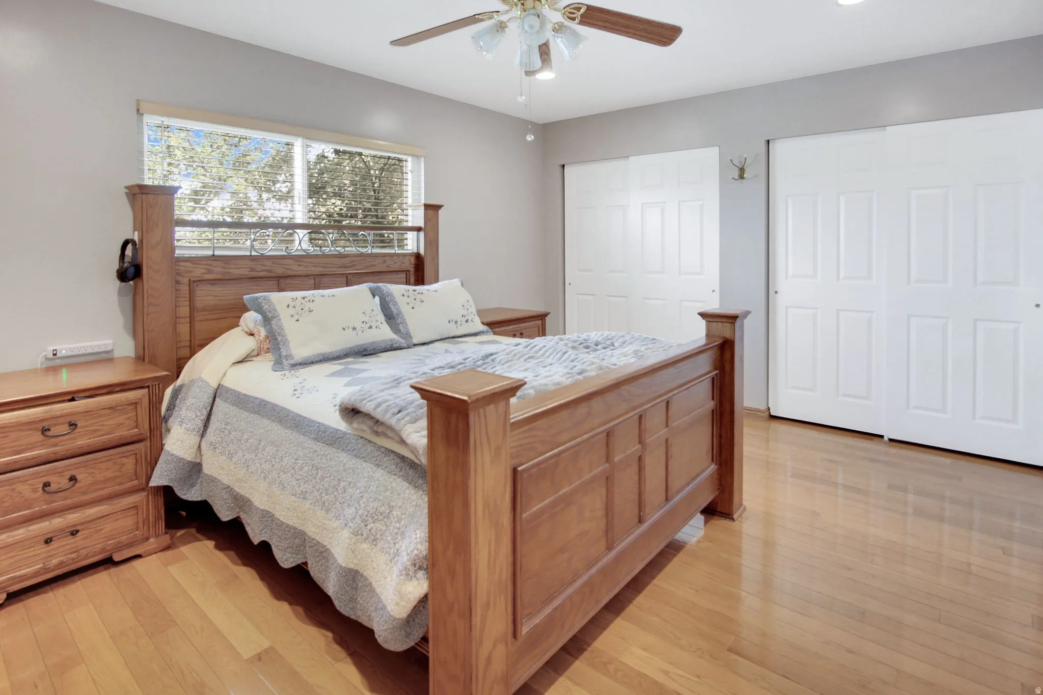 Light wood-finish flooring complements the neutral wall color