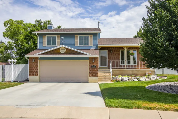 Two-story residence featuring brick and siding facade