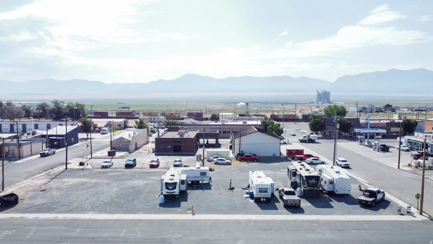 Expansive paved lot offering ample parking and storage space