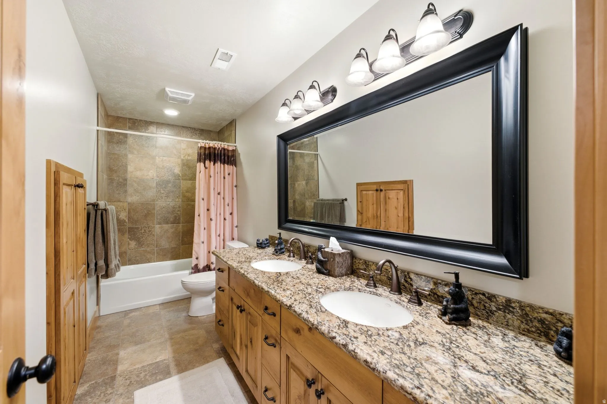 Double vanity with granite countertop and integrated sinks
