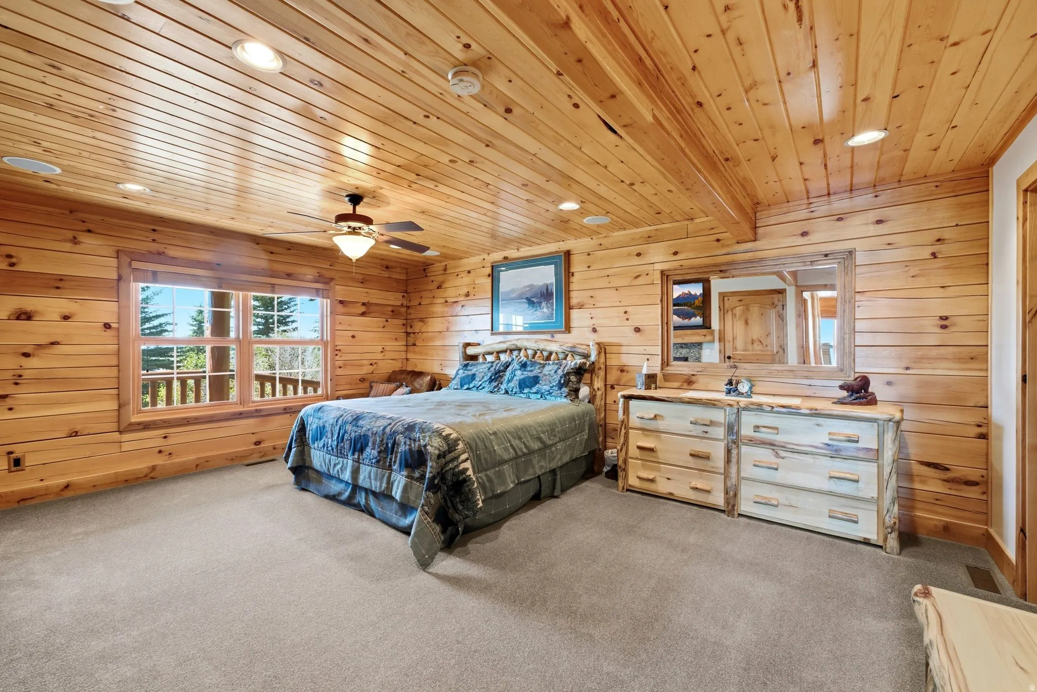 Interior room featuring wood-paneled walls and ceiling