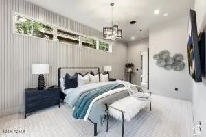 Recessed lighting, contemporary chandelier, and large clerestory windows
