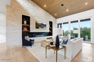 Vaulted wood-paneled ceiling with recessed lighting