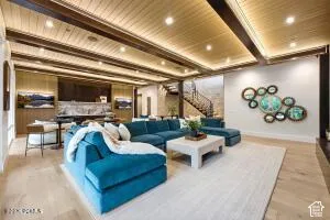 Coffered ceiling with recessed lighting and wood-finish beams