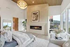 Vaulted ceiling with wood-finish paneling and recessed lighting