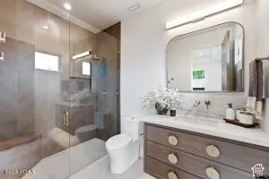 Glass-enclosed shower with bench seating and tiled walls