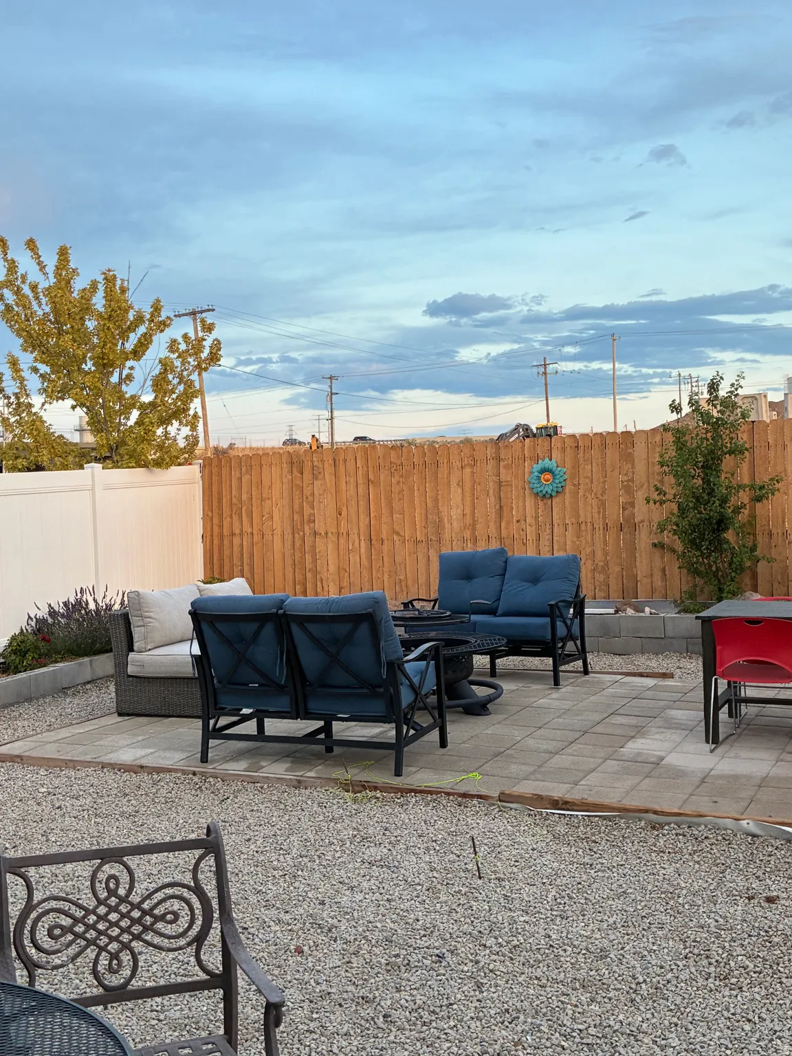 Outdoor paver patio framed by a gravel landscape