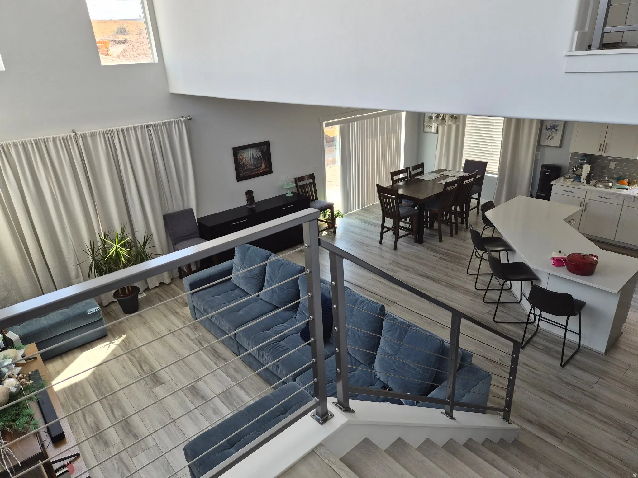 Two-story living area with high ceilings and skylight windows