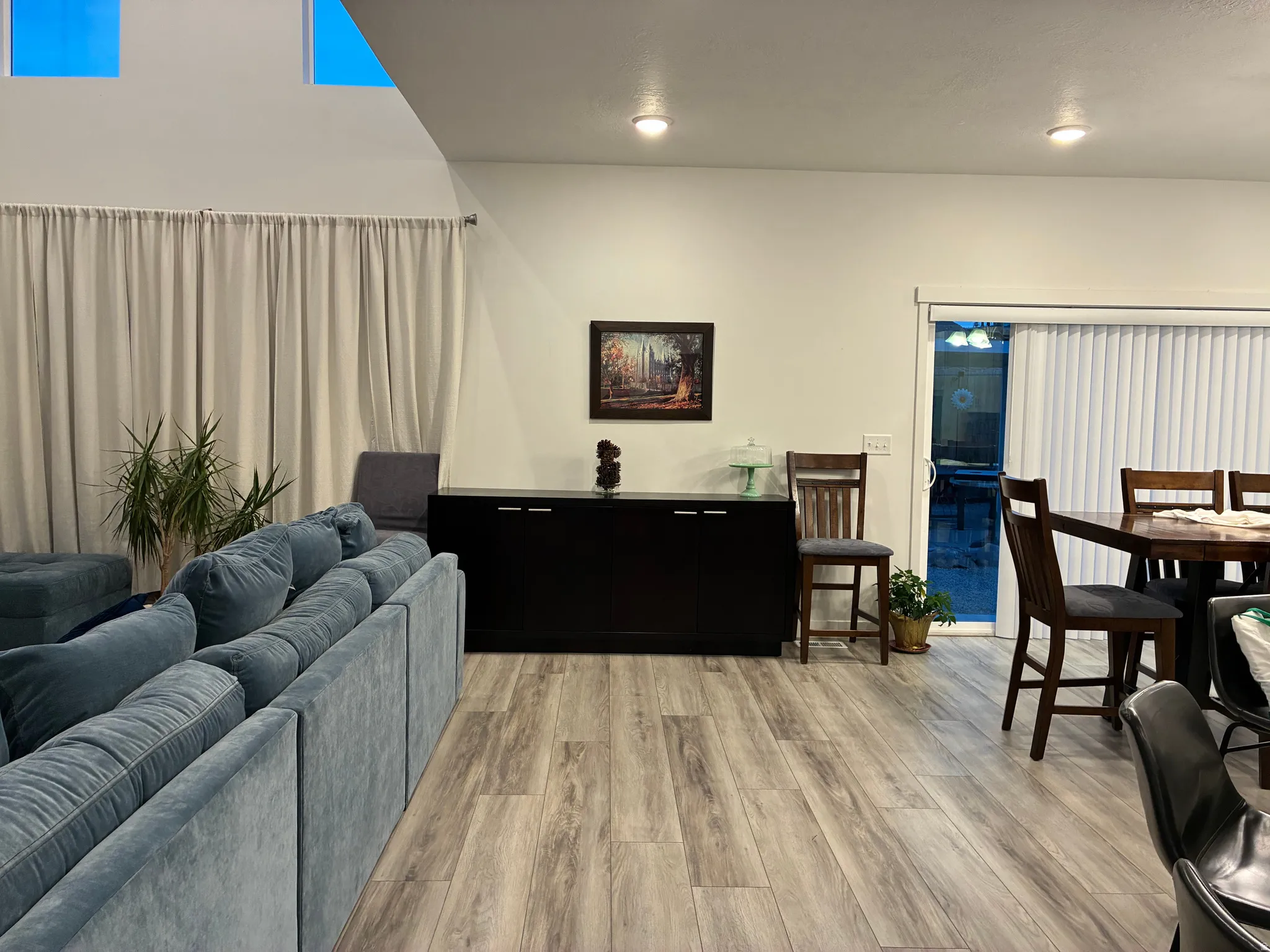 Vaulted ceilings with high windows complement light wood-finish flooring