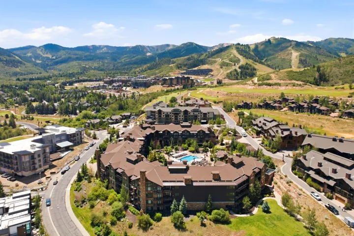 Aerial perspective showcasing a resort community with mountainous surroundings