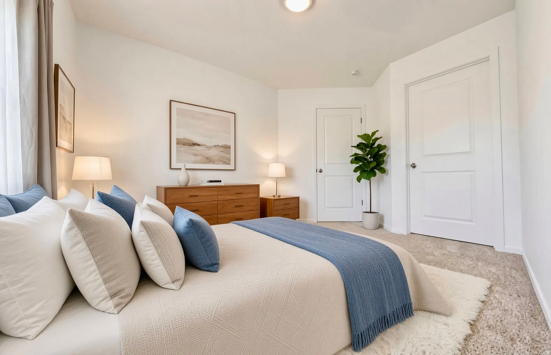 Light-toned carpeted flooring, white interior doors, and a neutral wall finish