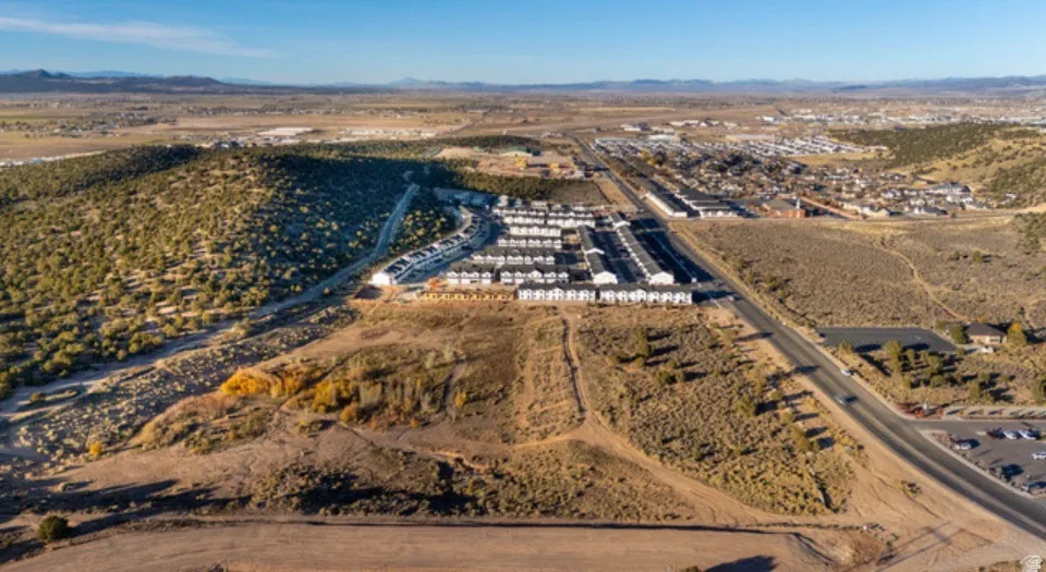 Aerial perspective showcasing a residential development with multiple unit buildings