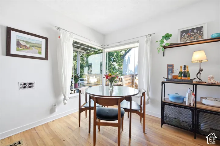 Hardwood flooring throughout, with white baseboards and trim