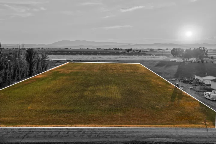 Expansive agricultural land featuring a flat topography and direct road frontage
