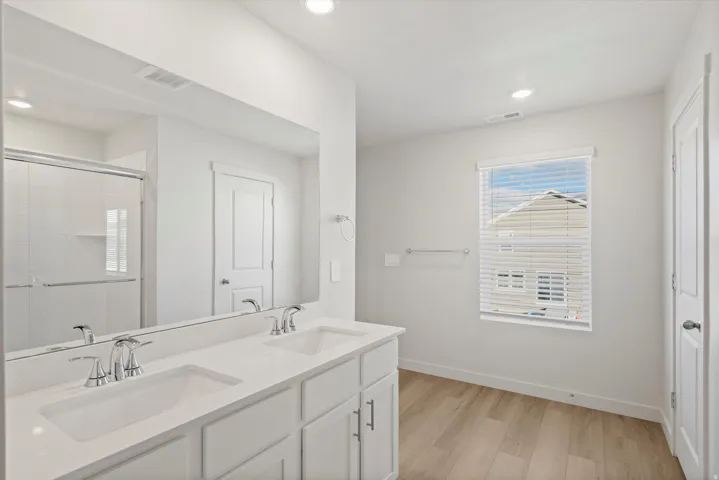 Dual vanity with integrated sinks and a white countertop
