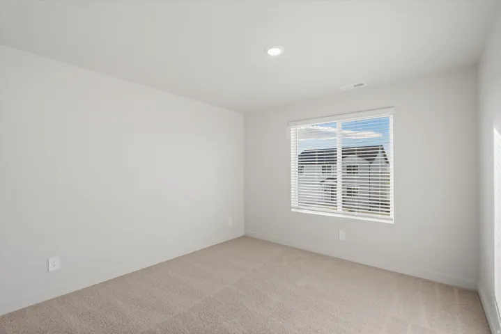 Neutral-toned carpeting and walls