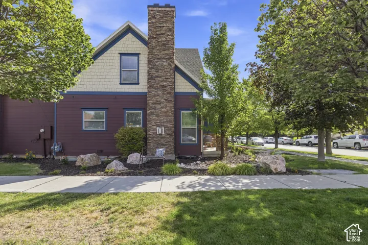Spacious side yard with sitting area. This could all be fenced with a short, white picket fence.