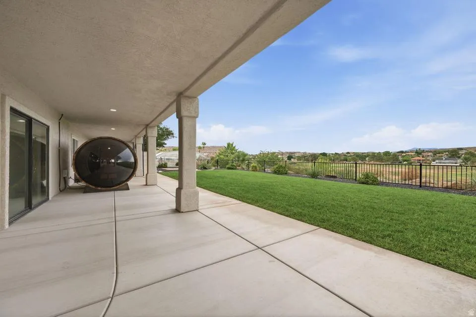 Expansive covered patio featuring a concrete surface and recessed lighting