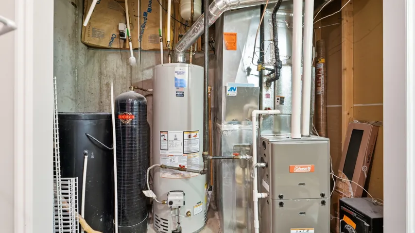 Heating and cooling systems with water heater and water treatment unit