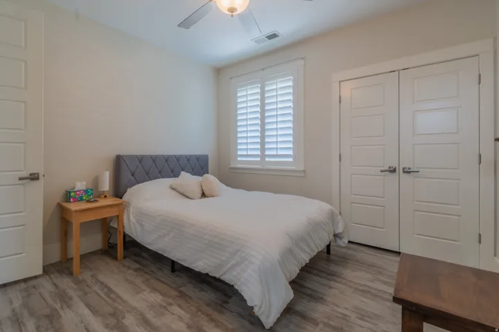 Bedroom featuring light-toned wood-finish flooring