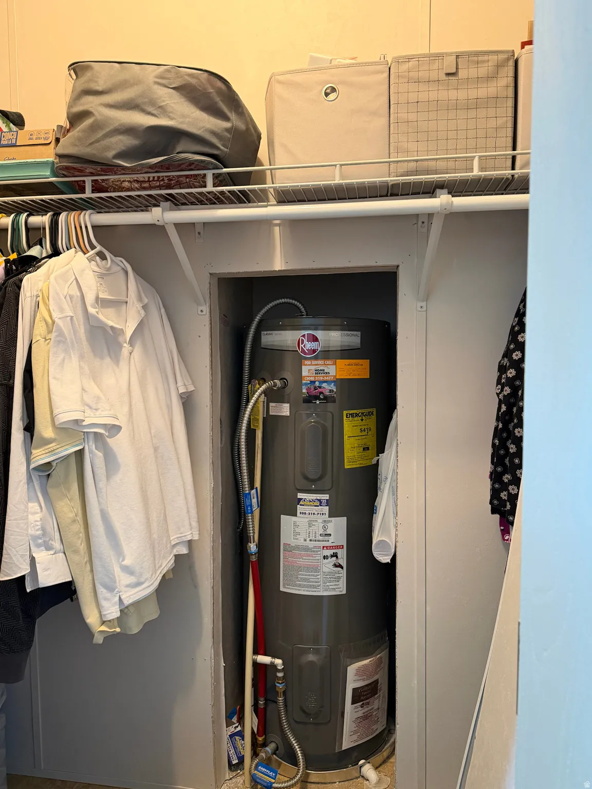 Integrated water heater system within a dedicated closet space, featuring visible plumbing connections