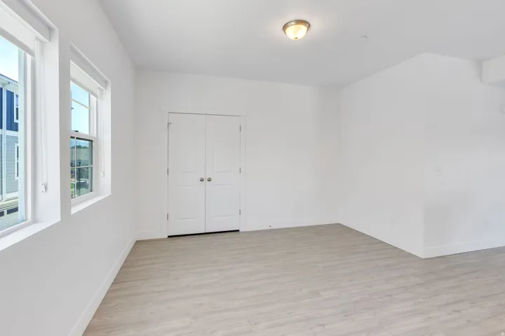 Bright interior space featuring light wood-finish flooring