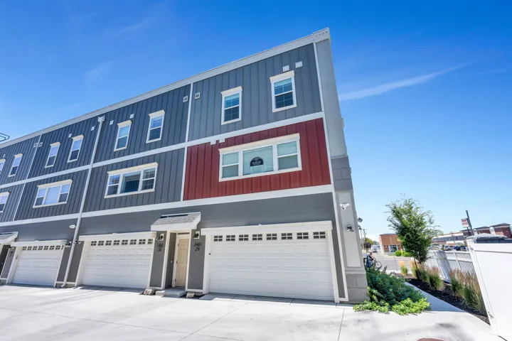 Modern multi-story exterior with horizontal siding and vertical panel accents