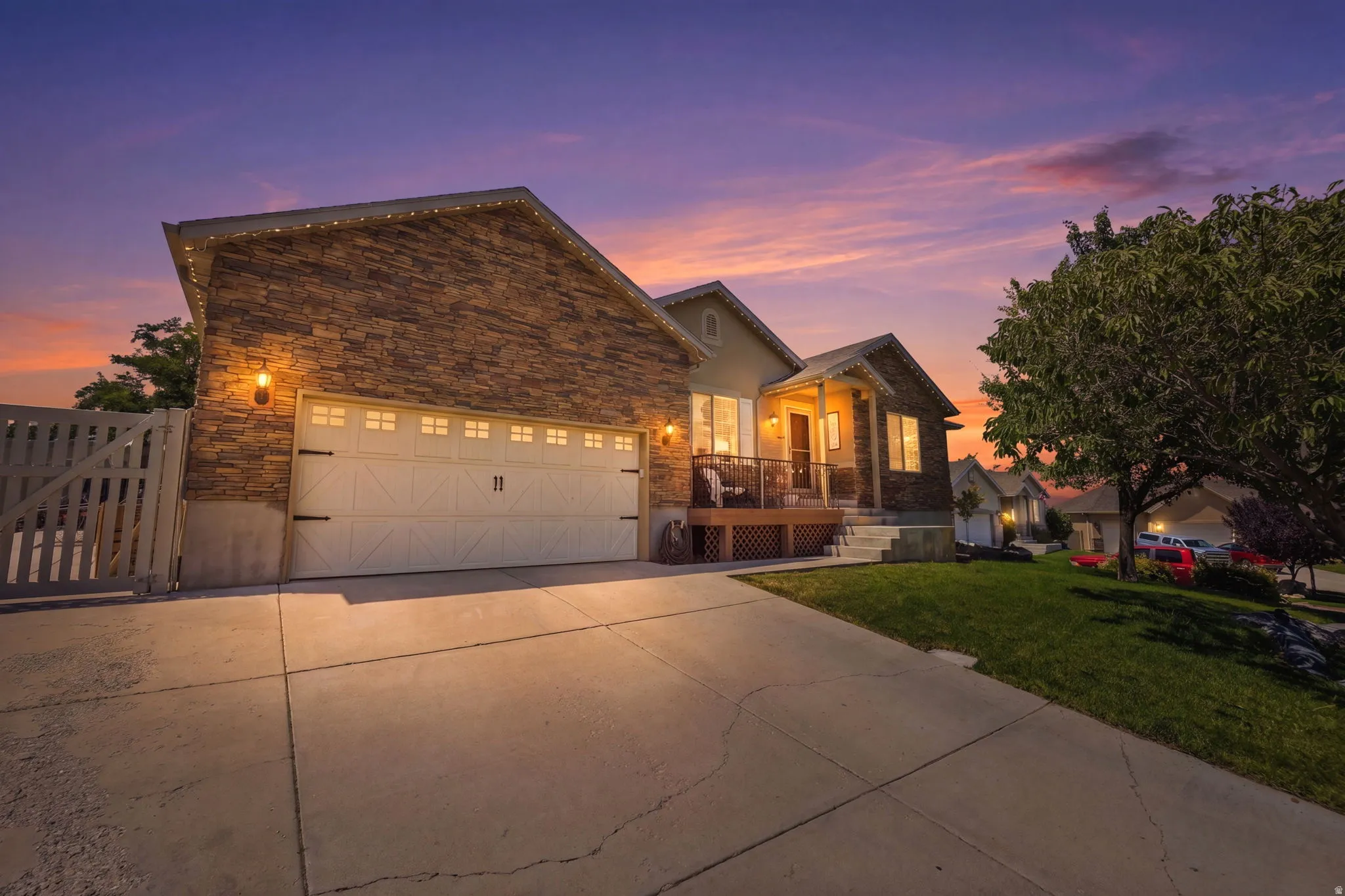 Exterior featuring stone veneer and stucco siding