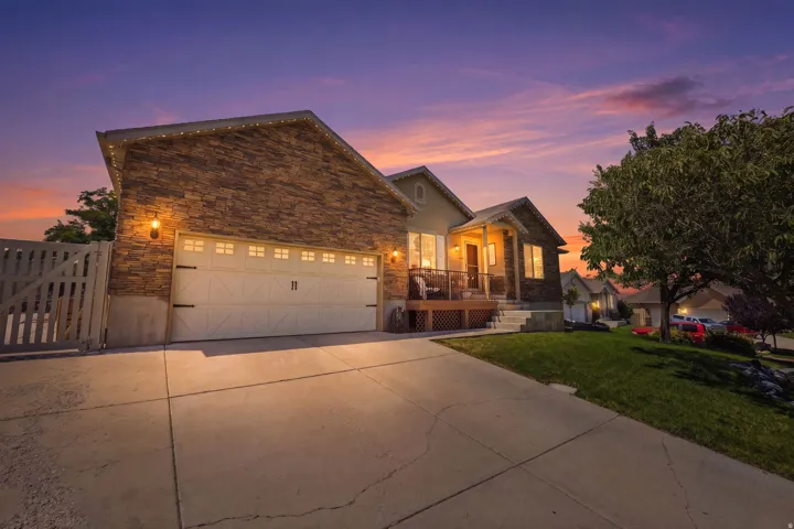 Exterior featuring stone veneer and stucco siding