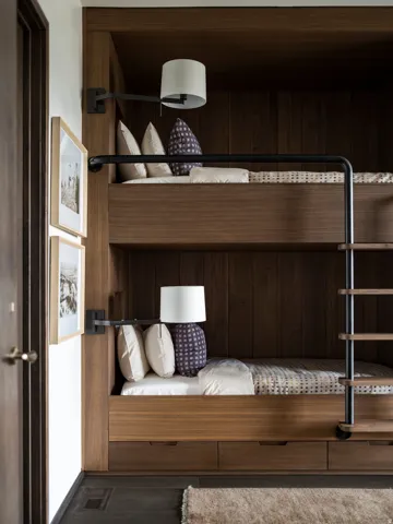 Built-in bunk beds crafted from rich wood-finish materials